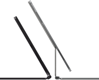 2 iPad Pro devices attached to Magic Keyboard, side exterior, thin profile, space black color with speakers and USB-C port, tilted half open, silver color, open, tilted back showing the keyboard’s floating cantilever design, speakers and microphone
